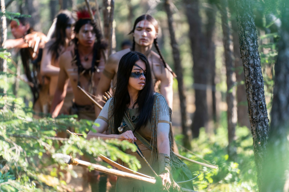 naru taabe and tribe walking through the woods