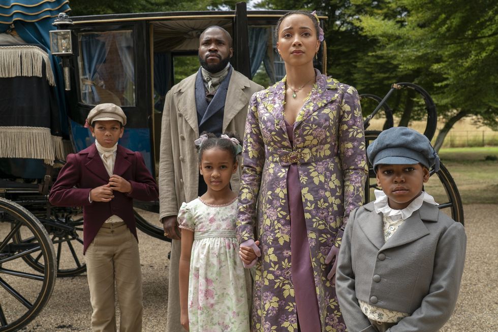 Photo of Will, his wife and kids coming out of a carriage, staring at something off camera from Bridgerton Season Three