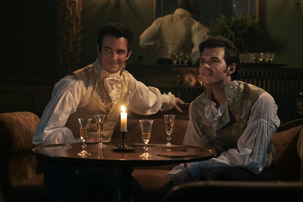Bridgerton brothers Benedict and Colin hanging at a table what might be a gentlemen's club in Season three Bridgerton